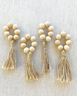 Load image into Gallery viewer, Natural Wood Bead Tassel Napkin Rings, set of 4
