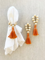 Load image into Gallery viewer, Natural Wood Bead Tassel Napkin Rings, Orange, set of 4
