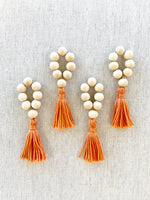 Load image into Gallery viewer, Natural Wood Bead Tassel Napkin Rings, Orange, set of 4

